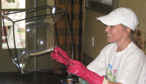 Here is a Picture taken about or representing a Best Bubble Party Birthday Boy or Girl Possibly Going Inside a Bubble at a Show For Kids, Children, Boys, and Girls as a Great Birthday Idea, School Assembly, Event, Festival, Carnival, Gathering, Picnic, Church Function, Temple Party, Bar Mitzvah, Bat Mitzvah, or Kids Party Idea.